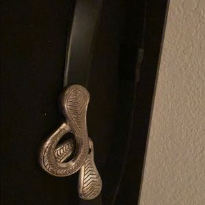 Black belt with a silver colored buckle